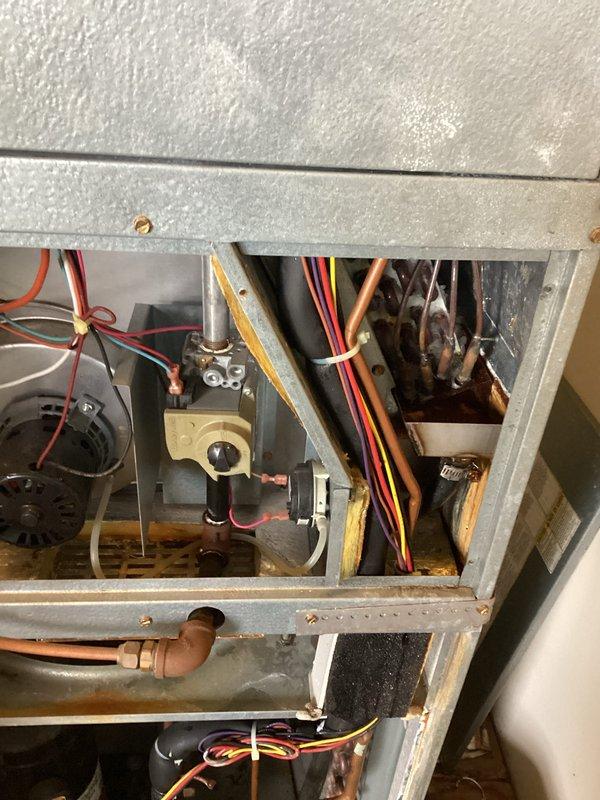 Responded to no cooling complaint on unit 5103. Upon arrival, accessed the indoor air handler and inspected the evaporator coil assembly and refrigerant line connections. Performed diagnostic evaluation of the system components, including examination of the refrigerant lines, electrical connections, and control mechanisms. Documented system conditions with photographs showing the insulated suction line, evaporator coil, copper refrigerant piping, and associated wiring. The evaporator coil exhibited dust accumulation on the fins, which can restrict airflow and reduce cooling efficiency. Inspected all visible electrical connections, control wiring, and brass valve components for proper operation.