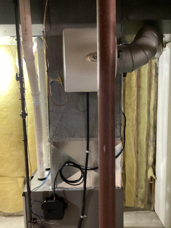 Completed full HVAC system installation including new outdoor condensing unit and indoor evaporator coil. Installed air conditioning unit on vibration-dampening pad with proper electrical disconnect box and conduit mounted to exterior wall. Ran refrigerant lines from outdoor unit to indoor coil located in basement mechanical room. Mounted evaporator coil with supply and return ductwork connections, ensuring proper airflow configuration. Utilized manifold gauges to charge system with refrigerant to manufacturer specifications and verified proper pressures. All electrical connections completed by licensed electrician. Installation performed with required permits and inspections. System tested for proper operation, refrigerant levels confirmed, and unit left in full working order.