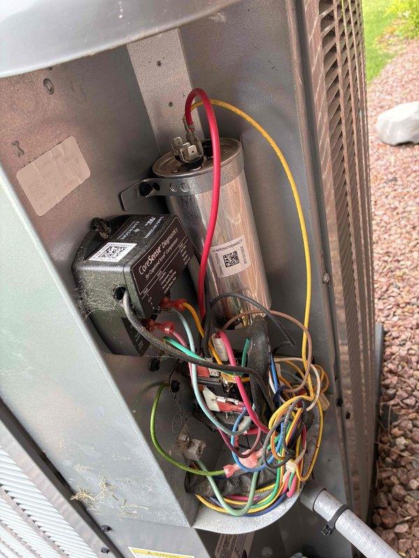 Responded to service call for air conditioning unit experiencing surging issues as part of prepaid membership cooling maintenance visit. Upon inspection, accessed electrical compartment and examined all internal components including capacitor, contactor relay, and associated wiring connections. Verified proper electrical connections, checked capacitor condition and ratings, and inspected control circuits for any loose or damaged wires that could cause intermittent surging behavior.