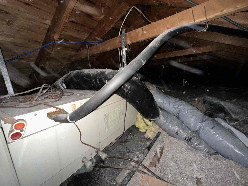 Conducted comprehensive estimate for attic air handler replacement due to severe system deterioration. Inspection revealed extensive corrosion and rust on existing ductwork and metal components, with significant oxidation, mineral deposits, and moisture damage indicating prolonged environmental exposure and compromised system integrity. Documented current HVAC system condition including corroded metal panels, aged flexible ductwork, and existing air handler unit, and provided replacement recommendations to restore proper heating and cooling functionality.