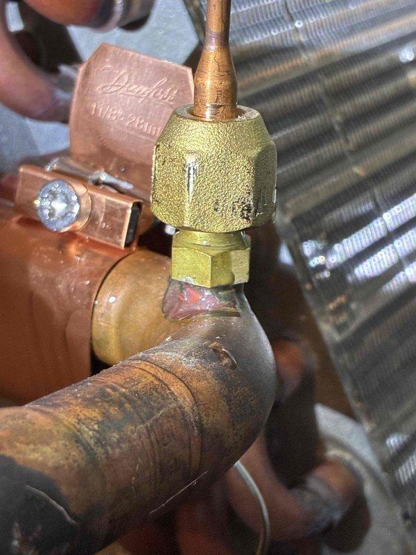 Installed thermostatic expansion valve (TXV) on residential air conditioning system per approved estimate. Connected refrigerant lines to new Danfoss TXV assembly with proper brazing techniques, verified sight glass operation, and performed system diagnostics with manifold gauges to confirm proper refrigerant flow and system pressures upon completion.