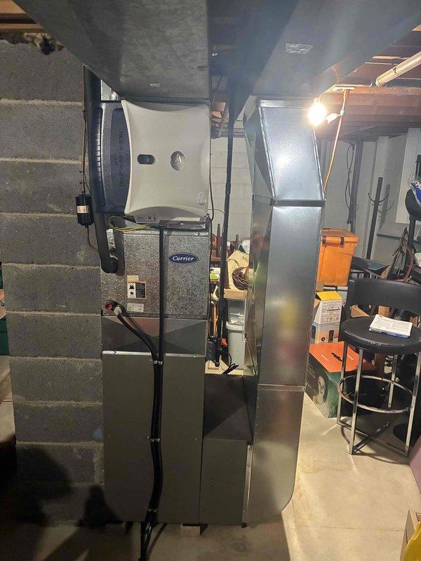 Conducted comprehensive assessment of residential HVAC system for replacement estimate. Evaluated existing 25-year-old Carrier furnace unit that had ceased operation and documented current equipment condition in basement mechanical room. Inspected electrical service panel to verify capacity and circuit breaker configuration for new system installation requirements. Customer expressed interest in upgrading to Lennox equipment to take advantage of available manufacturer rebates. Photographed existing furnace installation, ductwork configuration, water heater proximity, and electrical panel to support accurate equipment sizing and installation planning for replacement proposal.