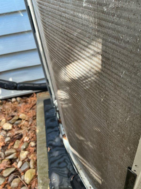 Completed scheduled prepaid membership cooling maintenance visit on residential Lennox air conditioning system. Performed comprehensive inspection of outdoor condensing unit, noting accumulated dirt and debris on mesh grille and surrounding area with seasonal leaf buildup. Verified electrical disconnect box connections, inspected refrigerant line set condition, and confirmed proper unit mounting on concrete pad. System operational and functioning within normal parameters upon completion of routine maintenance protocol.
