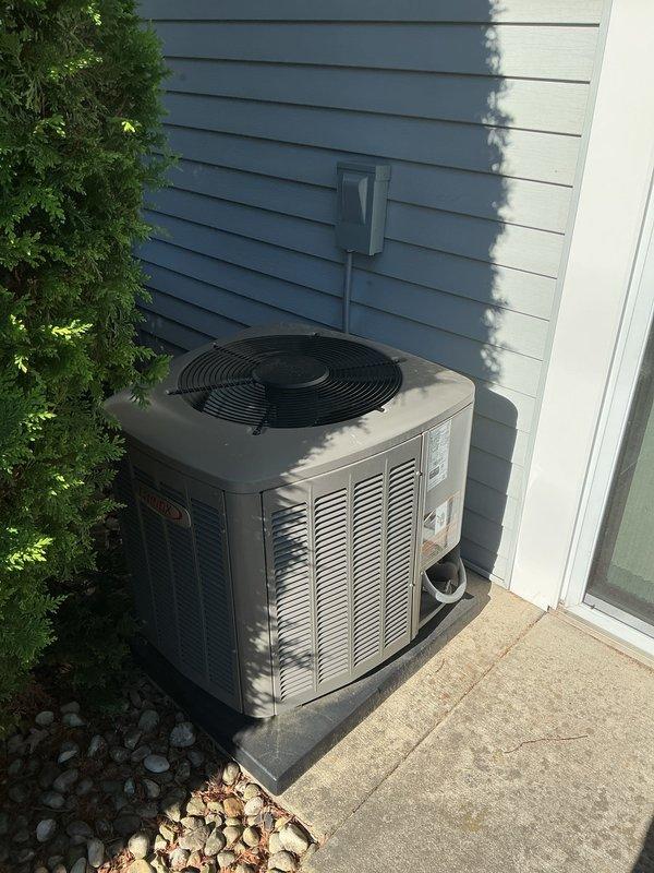 Completed scheduled prepaid membership cooling maintenance visit on residential Lennox air conditioning system. Performed comprehensive inspection of outdoor condensing unit, noting accumulated dirt and debris on mesh grille and surrounding area with seasonal leaf buildup. Verified electrical disconnect box connections, inspected refrigerant line set condition, and confirmed proper unit mounting on concrete pad. System operational and functioning within normal parameters upon completion of routine maintenance protocol.