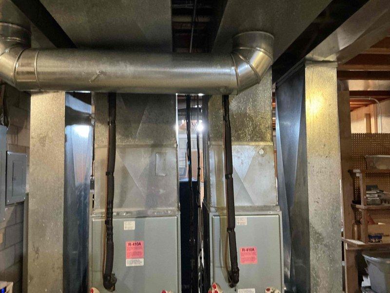 Completed on-site assessment for replacement of two natural gas furnaces located in basement mechanical room. Both units are over 20 years old and require replacement. Evaluated existing ductwork configuration and electrical connections. Discussed potential air conditioning system replacement as additional consideration for future work. Provided comprehensive estimate for dual furnace replacement project.