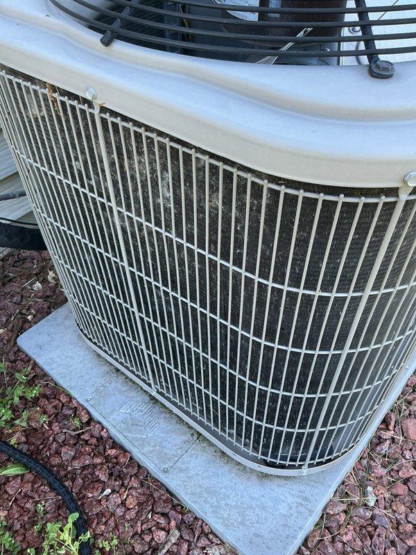 Completed prepaid membership cooling maintenance visit on residential air conditioning system. Performed standard inspection of outdoor condensing unit, which showed typical dirt and debris accumulation in condenser coils and between protective grille fins from environmental exposure. Unit operational and positioned on stable concrete pad with adequate clearance for airflow.