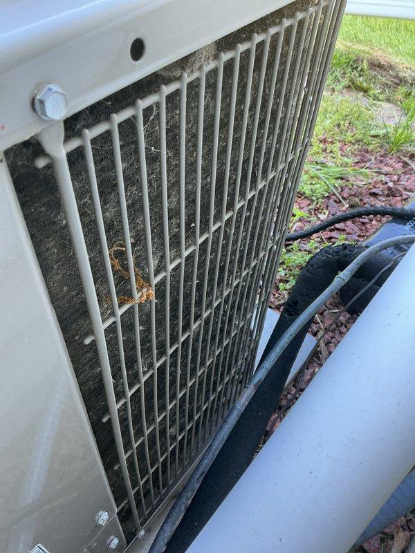 Completed prepaid membership cooling maintenance visit on residential air conditioning system. Performed standard inspection of outdoor condensing unit, which showed typical dirt and debris accumulation in condenser coils and between protective grille fins from environmental exposure. Unit operational and positioned on stable concrete pad with adequate clearance for airflow.