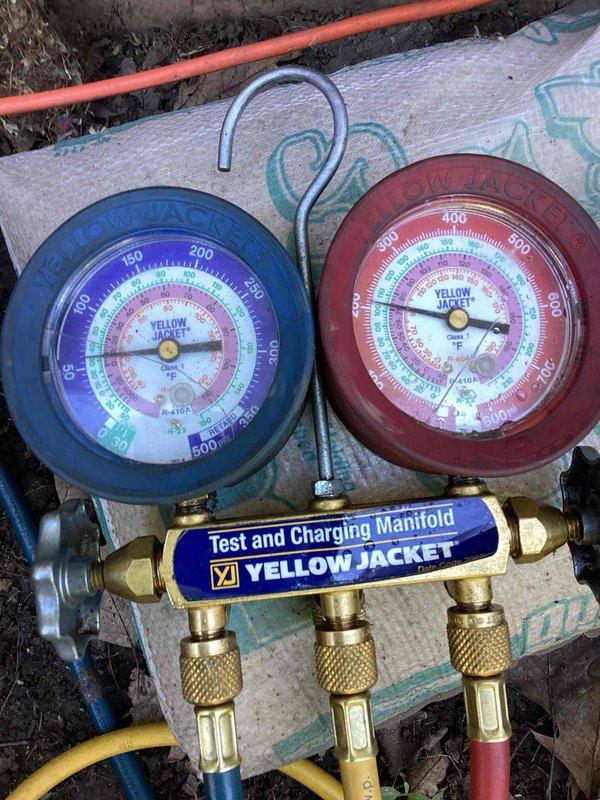 # HVAC Service Call - No Cool Condition

Responded to no cooling complaint on 10+ year old system. Customer reported outdoor unit runs approximately 20 minutes before shutting down and overheating, then fails to restart. 

Upon arrival, connected Yellow Jacket test and charging manifold gauge set to assess system pressures and diagnose the intermittent shutdown issue. Monitored refrigerant pressures on both high and low sides during system operation cycle. Observed unit behavior during runtime to identify thermal overload condition causing premature shutdown. 

Initial diagnostic findings indicate potential compressor overheating, failed contactor, or capacitor failure causing the outdoor unit to shut down on thermal protection. System requires further evaluation of electrical components and compressor amp draw to determine root cause of thermal shutdown and failure to restart condition.