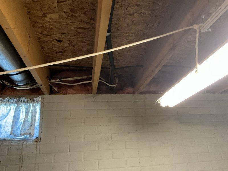 Conducted estimate for complete furnace and air conditioning system replacement in basement location. Evaluated existing natural gas furnace installation, assessed ductwork configuration including horizontal metal supply plenum, and documented current equipment specifications. Reviewed basement utility space layout with concrete block walls, exposed ceiling joists, existing PVC condensate drainage system, and copper refrigerant line routing for comprehensive replacement planning. Discussed available promotional options and provided equipment recommendations based on site conditions.