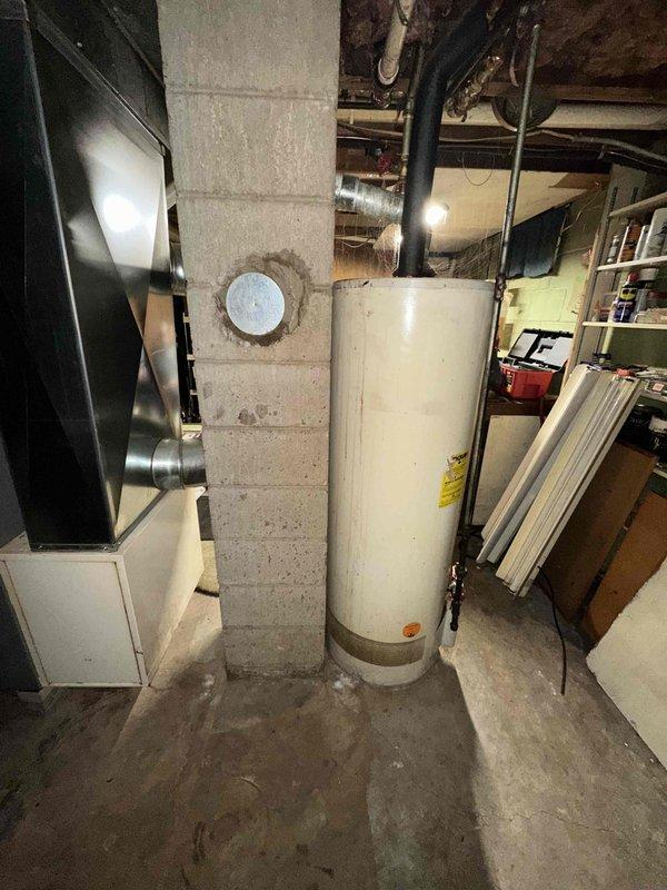 Completed estimate for replacement of 38-year-old air conditioning system that stopped working and natural gas furnace located in basement. Assessed existing outdoor condenser unit and indoor heating equipment, documented current system configuration including ductwork connections and electrical service, and provided replacement options for complete HVAC system upgrade.