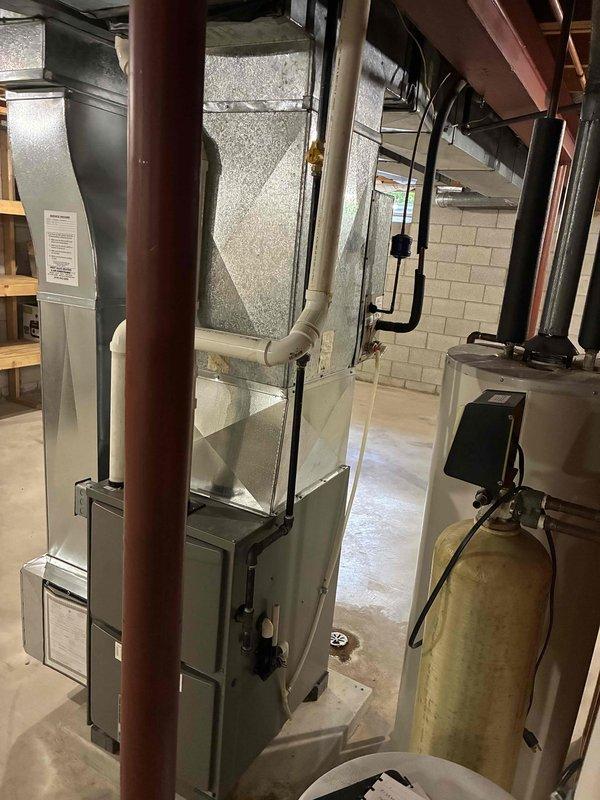 Conducted comprehensive estimate for complete HVAC system replacement including air conditioning unit and gas furnace in basement installation. Assessed existing equipment configuration, ductwork connections, and electrical requirements; documented current system layout with photographs and discussed military discount options with homeowner.