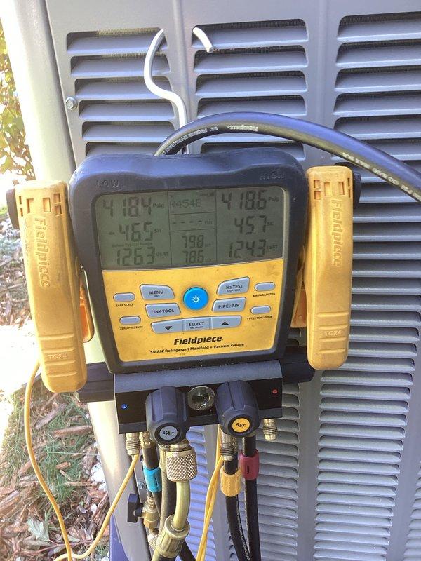Completed full HVAC system installation including new air conditioning condenser unit and evaporator coil. Flushed existing refrigerant line set to remove contaminants and ensure system integrity. Installed new refrigerant lines with proper insulation and secured all copper piping with brass fittings. Configured exterior PVC condensate drainage system with appropriate pitch and connections. Coordinated with licensed electrician for electrical disconnects and power supply connections. Pulled necessary municipal permits for installation. Pressure tested system, evacuated lines, and charged unit to manufacturer specifications. Verified proper superheat and subcooling readings using digital manifold gauges, confirming optimal refrigerant charge and system performance. All components secured to building exterior with proper mounting hardware and weatherproofing. System operational and running within normal parameters upon completion.