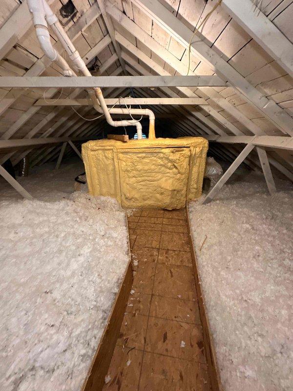 Completed comprehensive HVAC system replacement estimate for residential property, evaluating existing air handler unit located in basement utility closet and associated ductwork extending through attic space. Documented current equipment condition showing significant age-related wear, dust accumulation, and moisture concerns on concrete flooring, while assessing attic infrastructure including PVC condensate drainage lines, blown-in insulation coverage, and available access pathways for new equipment installation.