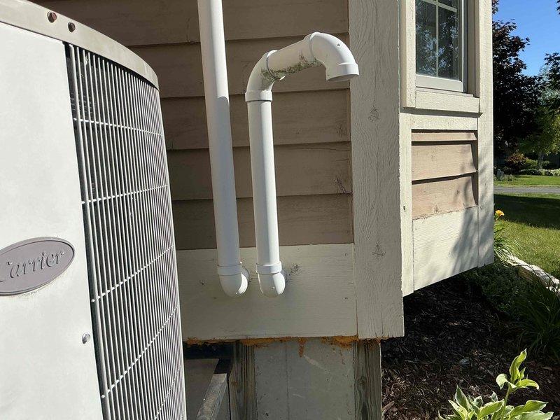 Conducted comprehensive estimate for replacement of 25-year-old natural gas furnace and air conditioning system, both currently operational but nearing end of service life. Evaluated existing exterior AC condenser unit mounted on elevated platform with weathered support structure, and basement-located NG furnace with walk-out access via sliding doors. Discussed available promotions, zoning options for basement climate control, and dehumidification system integration to address moisture management needs.