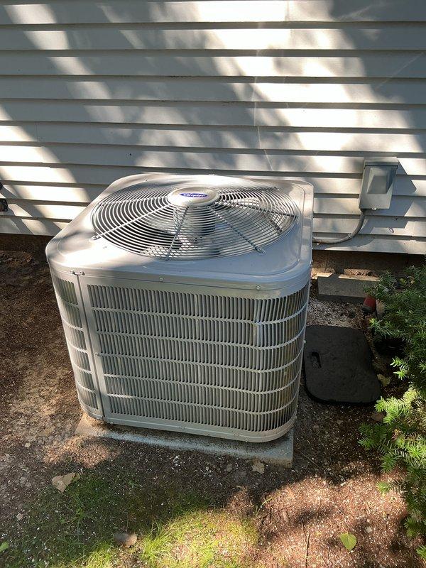 Completed comprehensive air conditioning tune-up on Carrier condensing unit (Model: CNPVP3017ALAAAAA, Serial: Z216X20407) manufactured May 2016 and charged with R-410A refrigerant. Performed standard preventive maintenance procedures including inspection of all major components, verification of electrical connections at disconnect box, assessment of condenser coil condition, and confirmation of proper unit operation on concrete pad mounting.