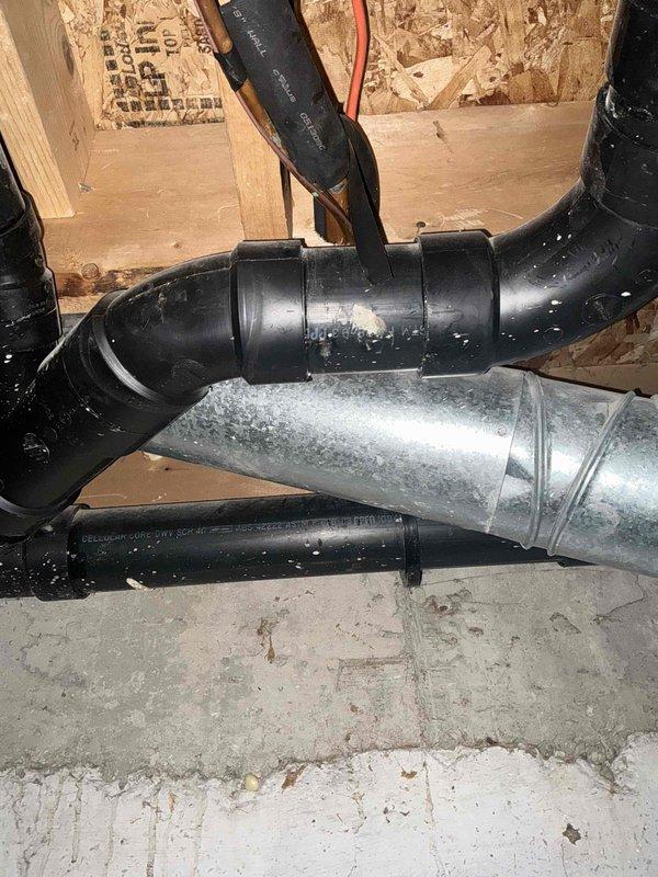 Conducted estimate for complete air conditioning system replacement due to refrigerant leak and freeze-up condition on 17-year-old unit. Assessed existing natural gas furnace in basement and documented current HVAC equipment configuration, including air handler with foil-wrapped ductwork and electrical connections, to provide comprehensive replacement recommendations for aging system that has reached end of serviceable life.
