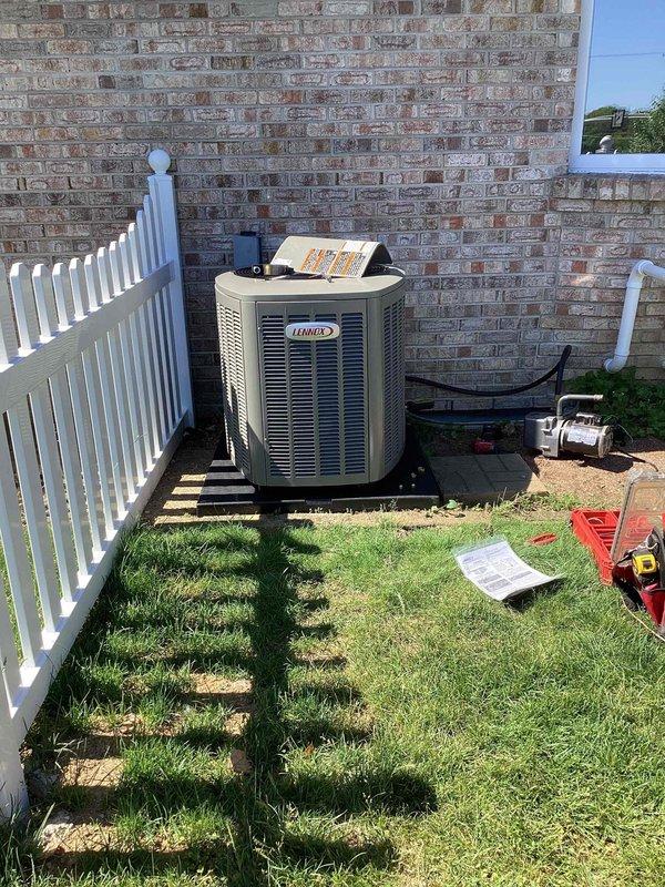 Completed full HVAC system installation including new Lennox air conditioning condenser unit and evaporator coil. Positioned condenser on concrete pad against exterior brick wall with proper clearances for airflow and serviceability. Installed copper refrigerant line set connecting outdoor condenser to indoor coil, with lines properly insulated and secured. Ran electrical conduit from disconnect to unit per code requirements. Coordinated with licensed electrician for electrical connections and power supply. Obtained all required permits prior to installation. Pressure tested refrigerant lines for leaks, evacuated system to proper vacuum levels, and charged unit to manufacturer specifications using calibrated Fieldpiece manifold gauges. Verified proper system operation including temperature differential, airflow, and refrigerant pressures across both high and low sides. Installation completed in compliance with local building codes and manufacturer installation guidelines.