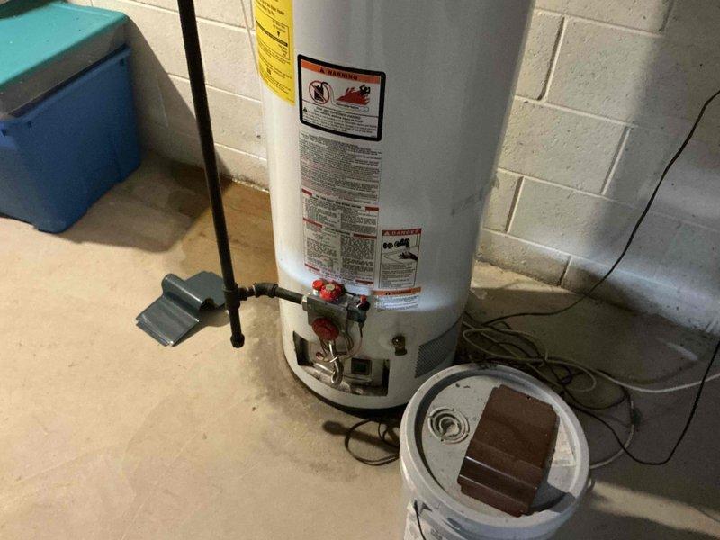 Conducted on-site assessment of non-operational residential water heater in basement utility area. Evaluated existing Guardian EverKleen Fury model unit, documented current installation including copper and PVC piping connections, shut-off valves, electrical conduit, and overall system configuration. Provided comprehensive replacement estimate for new water heater installation.