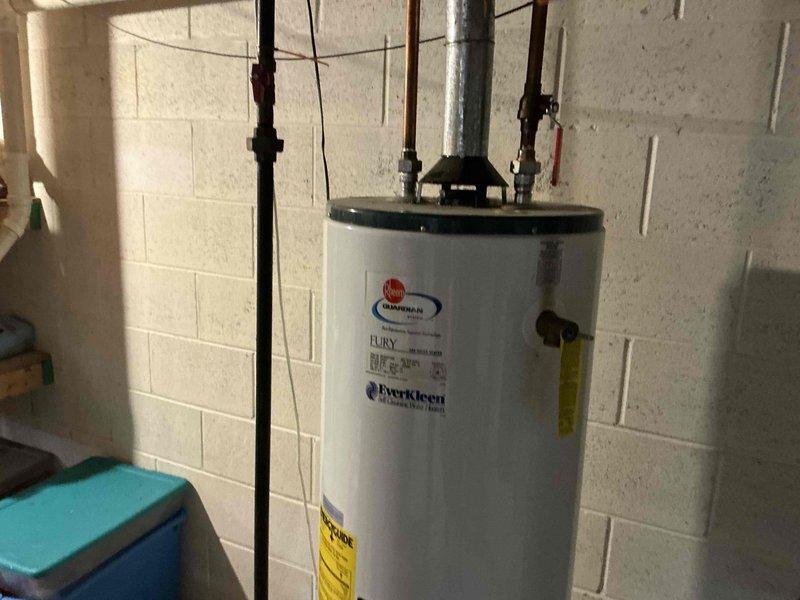 Conducted on-site assessment of non-operational residential water heater in basement utility area. Evaluated existing Guardian EverKleen Fury model unit, documented current installation including copper and PVC piping connections, shut-off valves, electrical conduit, and overall system configuration. Provided comprehensive replacement estimate for new water heater installation.