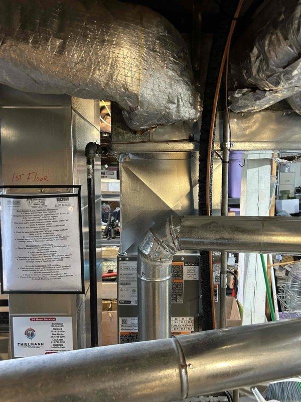 Completed full HVAC system installation including new air conditioning unit and evaporator coil. Installed new air handler unit in interior mechanical space with proper labeling for first floor zone identification. Ran and secured refrigerant line set from outdoor condensing unit to indoor coil using insulated copper piping routed through landscaped area with protective conduit. Connected all ductwork to air handler with insulated flex duct properly supported and sealed. Installed electrical disconnect and wiring with licensed electrician coordinating power connections to meet code requirements. Obtained and passed all required permit inspections for installation compliance.