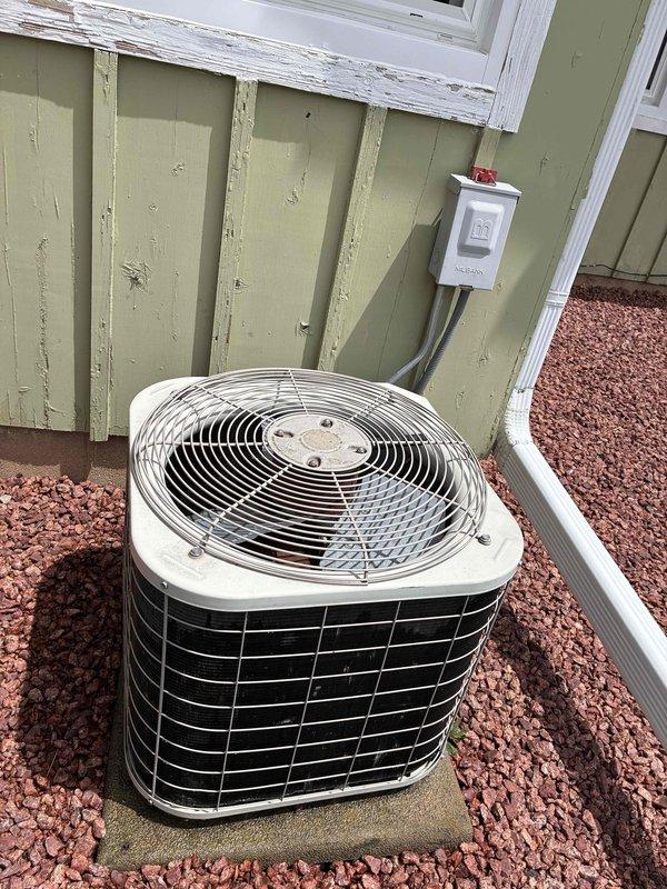 Completed preventive maintenance tune-up on residential air conditioning system at single-family home. Performed comprehensive inspection of outdoor condenser unit, verified electrical connections at disconnect box, checked refrigerant levels, cleaned condenser coils, and tested system operation to ensure optimal performance for the cooling season.