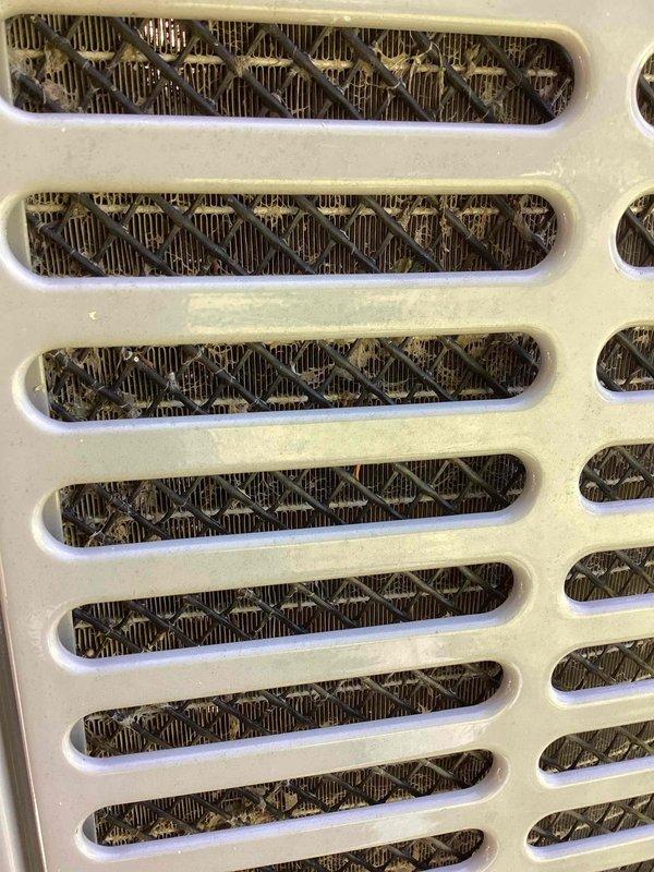 Performed diagnostic on air conditioning system that was running but failing to reach set temperature. Upon inspection, tested capacitor with multimeter and found component operating outside acceptable parameters. Also noted significantly restricted airflow due to heavily soiled return air filter requiring replacement. Identified these issues as primary causes preventing unit from achieving proper cooling capacity.