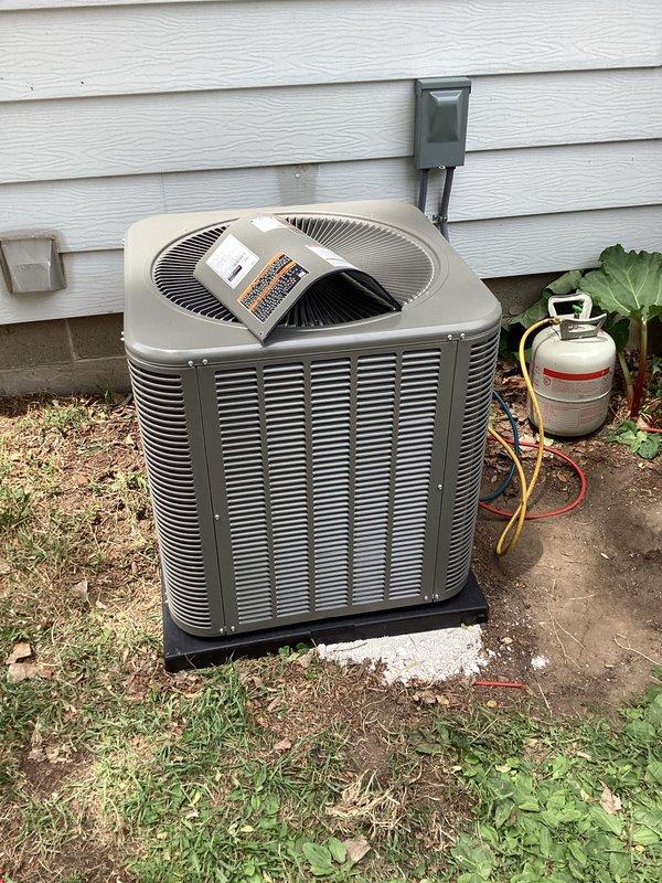 Completed full HVAC system installation including new air conditioning condenser unit and air handler. The outdoor condenser unit was positioned on a base pad against the building exterior with proper clearances maintained, refrigerant lines connected, and electrical service established. Inside, installed the air handler on elevated supports with all refrigerant lines properly insulated and secured, PVC condensate drain lines routed and terminated correctly, and electrical connections completed to code. System was pressure tested, evacuated, charged with refrigerant to manufacturer specifications, and fully commissioned with all operational parameters verified within normal range.