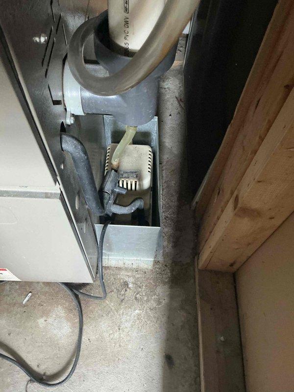 Performed comprehensive assessment of two non-operational air conditioning systems and evaluated existing furnace units to determine replacement requirements. Inspected exterior condenser units, electrical disconnects, and refrigerant line sets mounted on building exterior. Evaluated interior equipment including furnace located in closet and second furnace in laundry room, both installed without basement access. Documented existing HVAC infrastructure including ductwork, condensate drainage systems, and electrical connections. Prepared replacement estimates for dual AC systems and provided professional recommendation regarding furnace replacement needs based on equipment condition and system compatibility requirements.