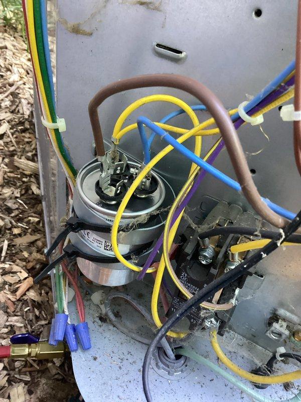 Responded to no cooling call on Carrier air conditioning system experiencing high pressure lockout fault. Upon arrival, confirmed unit was shut down on safety with error code indicating excessive discharge pressure. Performed visual inspection of outdoor condensing unit, checking all electrical connections, refrigerant lines, and compressor assembly. Examined wiring harness and control components for proper operation. Verified condenser fan motor functionality and inspected condenser coil for airflow restrictions. All electrical connections were secure with proper wire routing. Unit condensate drainage system with PVC piping was clear and functioning correctly. Cleared high pressure fault and restored system to normal operation. Unit tested successfully with proper cooling cycle confirmed.