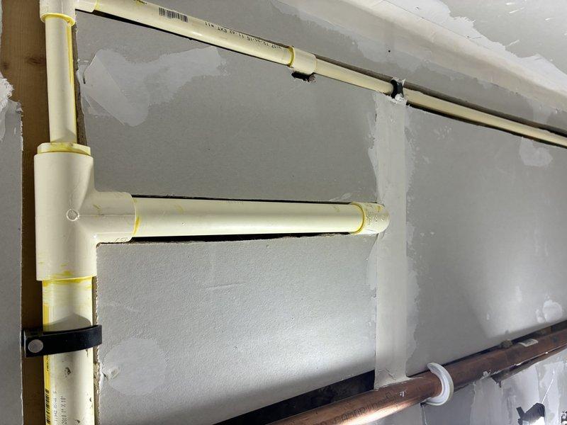 Responded to service call for water filtration system installation consultation. Upon arrival, assessed existing plumbing infrastructure including PVC and copper supply lines with wall-mounted supports. Evaluated current water treatment equipment setup featuring dual-tank filtration system with pressure gauge monitoring panel and control valves. Documented existing conditions and plumbing configuration to provide accurate estimate for whole-house water filtration installation.