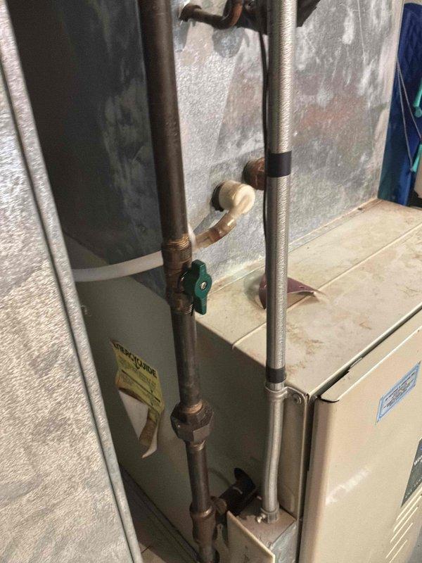 Conducted comprehensive duct cleaning estimate for residential HVAC system featuring vertical air handler unit with flexible ductwork connections in basement utility area. Assessed accessible ductwork, air handler cabinet, and adjacent furnace system with copper piping to determine scope of cleaning services required for optimal system performance and indoor air quality improvement.