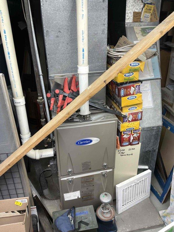Completed estimate for adding air conditioning system to existing home with Carrier furnace located in basement mechanical room. Assessed current HVAC infrastructure including ductwork, electrical service, and available space for outdoor condenser unit placement. Documented existing furnace model and configuration, photographed mechanical room layout and utility connections to determine compatibility and requirements for AC integration with current heating system.