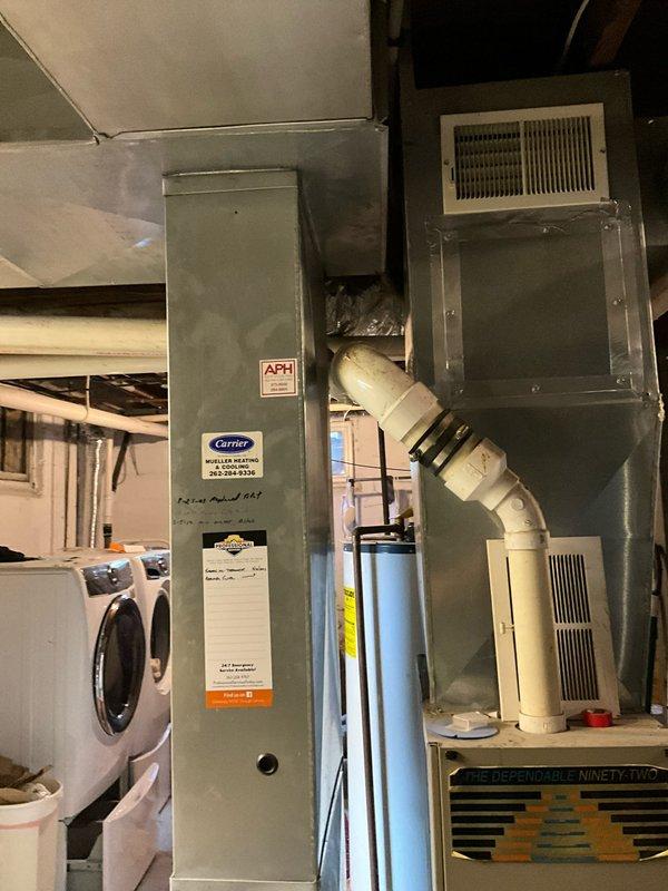 Conducted on-site assessment of existing HVAC system in residential basement to provide two separate replacement estimates. Evaluated aging natural gas furnace from the 1970s-80s era, currently operational but requiring replacement consideration, along with existing Carrier air handler unit. Prepared estimate options for adding air conditioning to the home as a standalone upgrade, and a second comprehensive estimate for complete furnace replacement with integrated AC installation. Documented equipment conditions, ductwork configuration, and basement installation parameters through photographic records. Assessed electrical capacity, gas line accessibility, and drainage requirements for potential condensate management in new AC system installation.