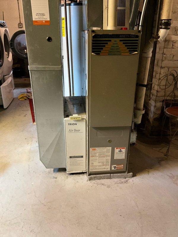 Conducted on-site assessment of existing HVAC system in residential basement to provide two separate replacement estimates. Evaluated aging natural gas furnace from the 1970s-80s era, currently operational but requiring replacement consideration, along with existing Carrier air handler unit. Prepared estimate options for adding air conditioning to the home as a standalone upgrade, and a second comprehensive estimate for complete furnace replacement with integrated AC installation. Documented equipment conditions, ductwork configuration, and basement installation parameters through photographic records. Assessed electrical capacity, gas line accessibility, and drainage requirements for potential condensate management in new AC system installation.