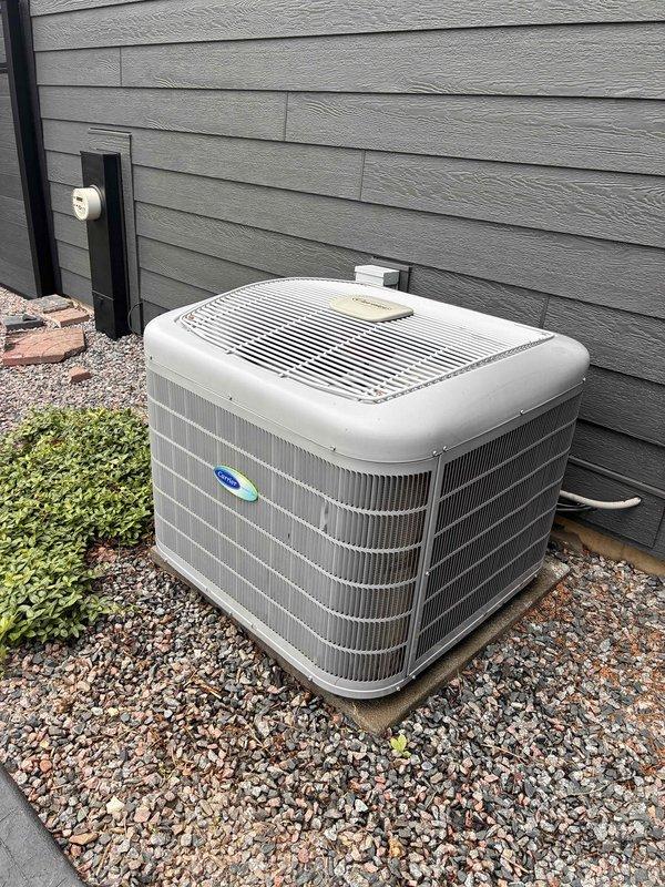 Completed routine A/C tune-up and system inspection as part of recurring membership maintenance visit. Verified proper airflow and temperature differential at supply register, measuring 54°F discharge temperature, and inspected outdoor condenser unit for proper operation and clearance. All components functioning within normal parameters with no issues identified during service.