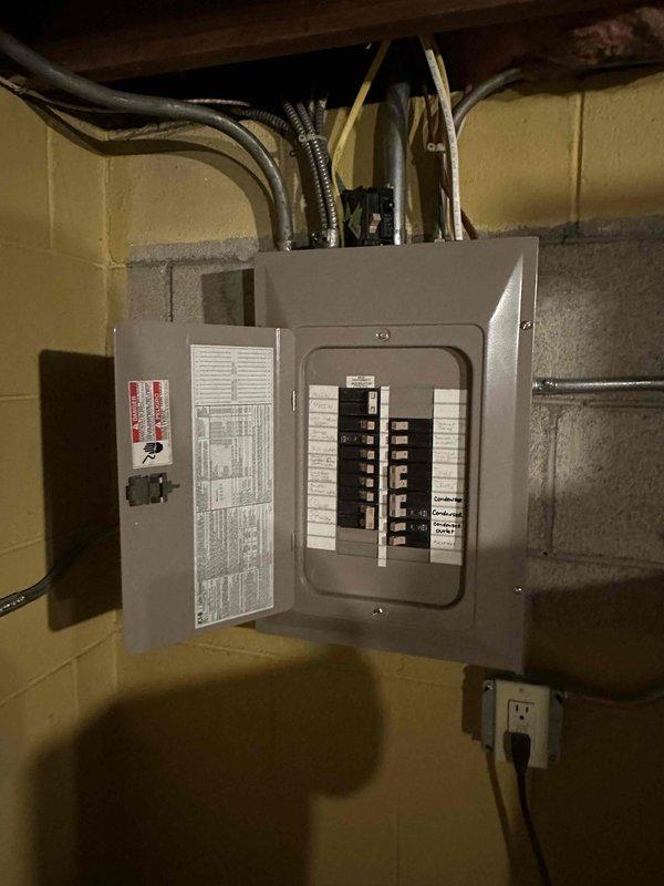 Conducted on-site evaluation for boiler replacement in residential basement mechanical room. System found to be non-operational and requiring full replacement. Documented existing electrical panel configuration, current HVAC equipment layout including furnace unit, plumbing infrastructure with water treatment components, and available workspace for new boiler installation. Assessed electrical service capacity and existing piping connections to determine scope of replacement work and equipment specifications needed for proper system sizing and installation planning.