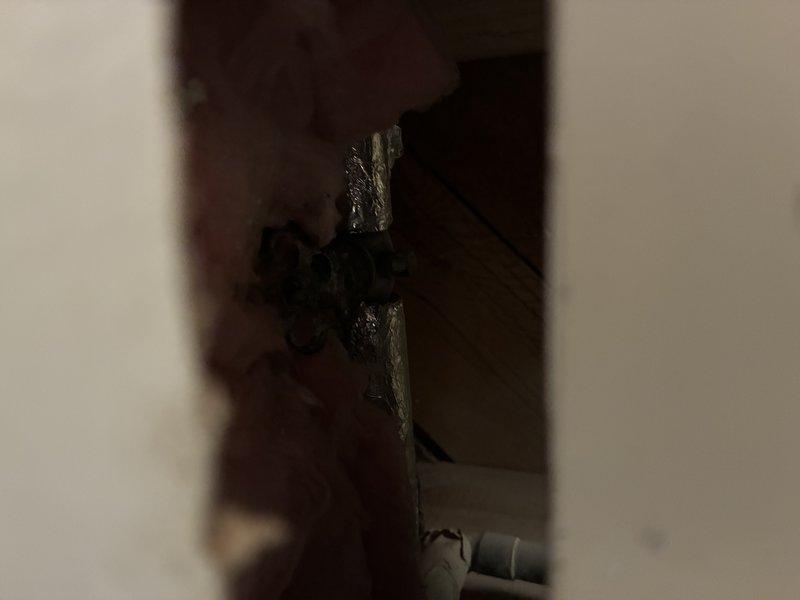 Responded to service call for non-functioning hose bib with broken or seized shut-off valve. Accessed crawlspace area to locate and inspect interior shut-off valve controlling exterior spigot. Valve was found to be locked up and inoperable, preventing proper water flow control to outdoor hose bib. Provided diagnostic assessment and repair estimate to customer for valve replacement.