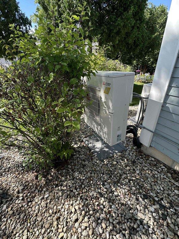 Responded to emergency service call for attic-mounted air handler with connected mini-split system experiencing refrigerant leaks in both units. Assessed dual system configuration in attic space with flexible ductwork and evaluated outdoor condenser unit to determine extent of refrigerant loss and provide replacement estimate for failed components.