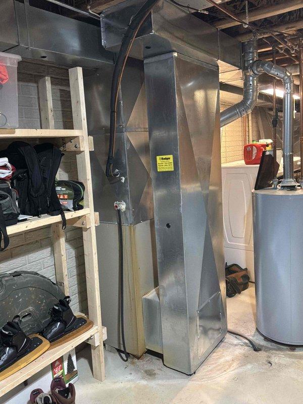 Conducted on-site evaluation of 20+ year old 80% efficiency Lennox natural gas furnace located in basement that has been experiencing operational issues. Assessed existing equipment condition, electrical panel connections, and ductwork configuration to provide comprehensive replacement estimate for new furnace system.