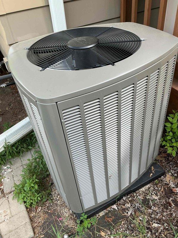 Responded to service call for AC unit producing loud buzzing noise and causing lights to dim upon startup, indicating potential electrical issues. Upon inspection, found outdoor condensing unit showing signs of weathering and dirt accumulation on exterior panels. Performed diagnostic assessment of electrical components and compressor operation to identify source of abnormal noise and voltage draw. Unit is covered under active parts and labor warranty installed earlier this year.