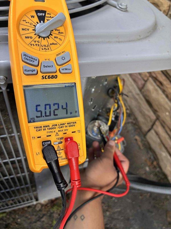 Completed routine air conditioning tune-up and maintenance visit as part of recurring cooling system service agreement. Performed comprehensive system diagnostics using digital multimeter to verify electrical readings, measuring voltage at 5.024V and capacitance at 38.68 MFD on outdoor unit components to ensure proper operation and identify any potential issues before they impact system performance.