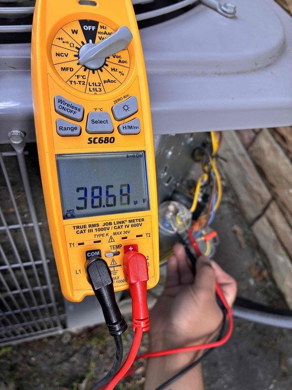 Completed routine air conditioning tune-up and maintenance visit as part of recurring cooling system service agreement. Performed comprehensive system diagnostics using digital multimeter to verify electrical readings, measuring voltage at 5.024V and capacitance at 38.68 MFD on outdoor unit components to ensure proper operation and identify any potential issues before they impact system performance.