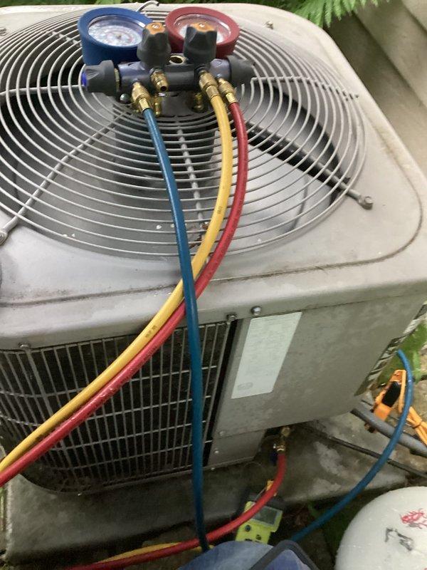 Responded to no cooling complaint on 10+ year old air conditioning system. Connected manifold gauge set to outdoor condenser unit and evaluated refrigerant pressures and system performance. System was not maintaining adequate cooling capacity for the structure.
