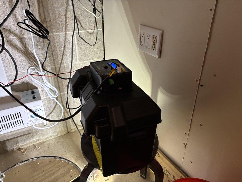 Installed battery backup sump pump system in basement utility area. Completed all electrical connections, plumbing integration with existing discharge piping, and performed operational testing to verify proper functionality of both primary and battery backup components.