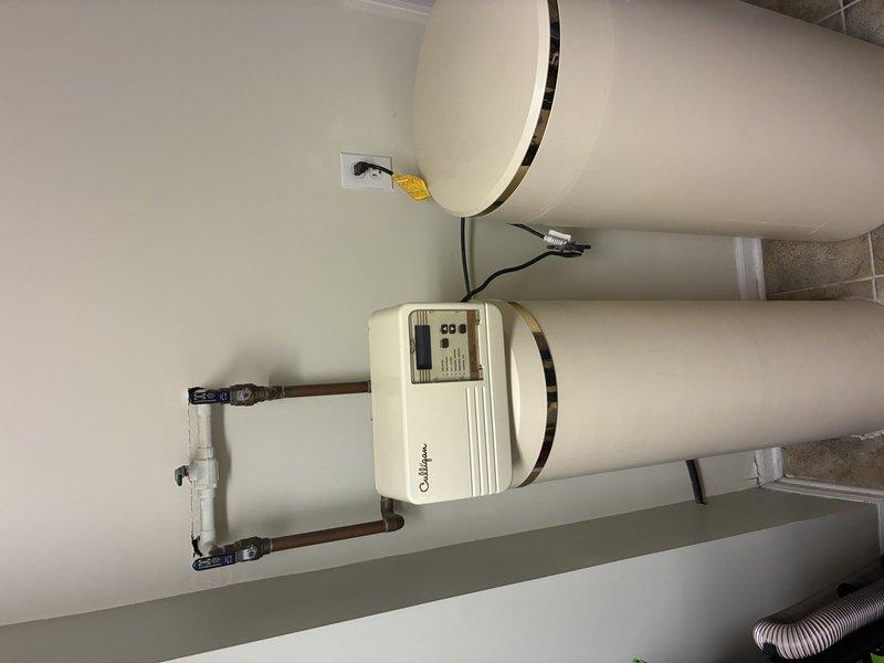 Conducted on-site evaluation for water softener installation estimate. Assessed existing plumbing infrastructure, including dual water heater system with control unit and copper piping configuration in mechanical room. Documented current setup and determined optimal installation location and connection points for proposed water conditioning system.