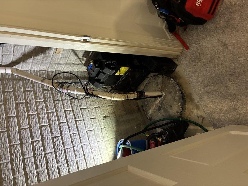 Completed installation of battery backup sump pump system in residential basement. Successfully integrated the backup unit with existing primary sump pump in concrete basin, established proper electrical connections with 12-2 wiring, and verified operational functionality of both primary and backup systems. All components tested and confirmed working properly to ensure continuous water removal capability during power outages.