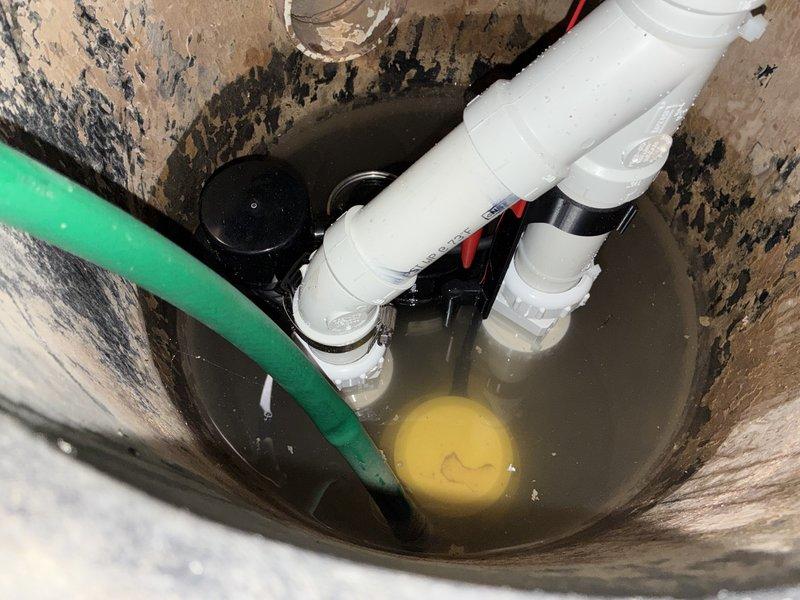 Completed installation of battery backup sump pump system in residential basement. Successfully integrated the backup unit with existing primary sump pump in concrete basin, established proper electrical connections with 12-2 wiring, and verified operational functionality of both primary and backup systems. All components tested and confirmed working properly to ensure continuous water removal capability during power outages.