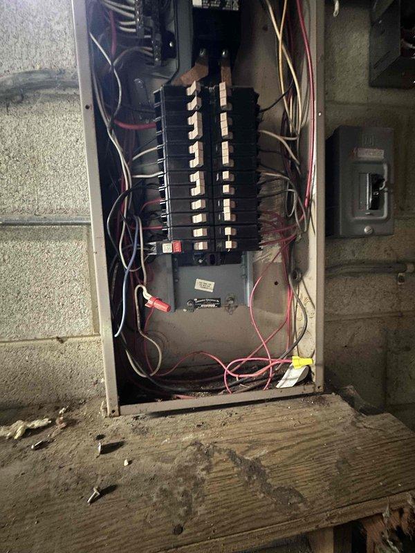 Conducted on-site assessment for mini split system installation in residential property. Evaluated basement area for potential indoor unit placement and reviewed existing electrical panel capacity to determine compatibility with new mini split system requirements. Documented current electrical infrastructure including available circuit breaker positions and verified adequate amperage for equipment installation.