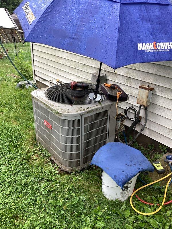 Completed scheduled cooling system maintenance on Bryant air conditioning unit as part of prepaid membership service. Performed comprehensive tune-up including refrigerant pressure testing using manifold gauge set, inspected internal components with top panel removed, and verified proper operation of condenser fan and refrigerant lines. All systems operating within normal parameters upon completion of service.
