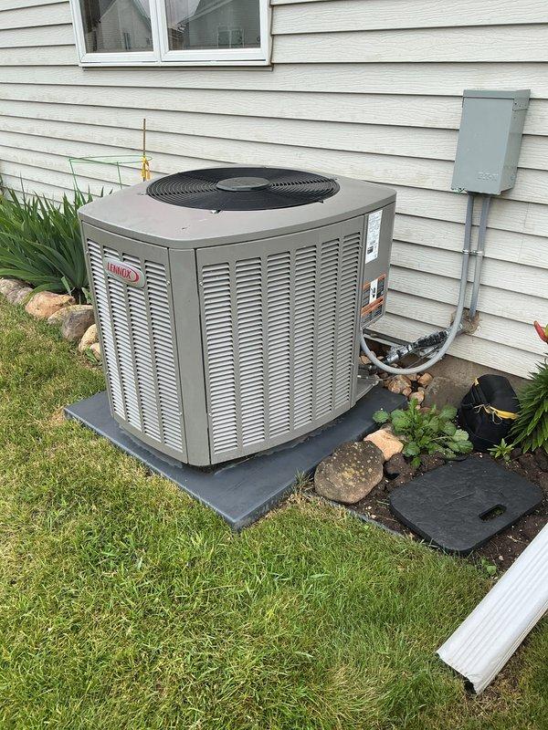 Completed scheduled cooling season maintenance visit under membership agreement. Performed comprehensive AC tune-up on Lennox outdoor condensing unit, including inspection of all major components, electrical connections, and refrigerant levels. Inspected evaporator coil and found moderate dust accumulation on fin surfaces; coil remains functional but showing signs of typical operational debris. Verified proper system operation, airflow, and drain pan condition. Unit operating within normal parameters upon completion of service.